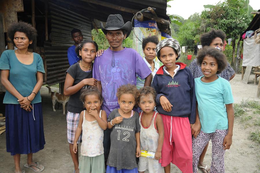 write two paragraph essay describing aeta family depicted in the photo