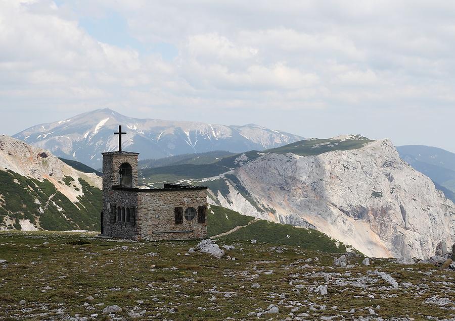 Small church on mountain ridge