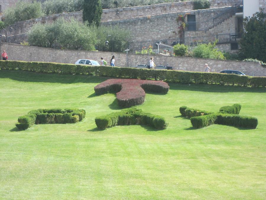 Assisi - PAX symbol on lawn in front of Franciscan Monastery