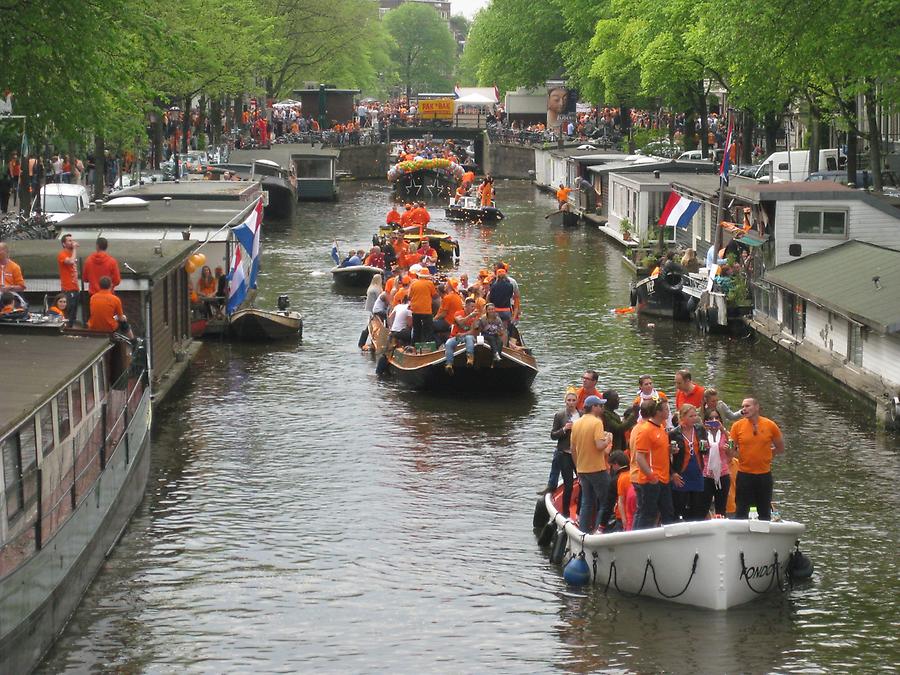 Amsterdam - Koningtag - Boat Parade with people dressed in orange